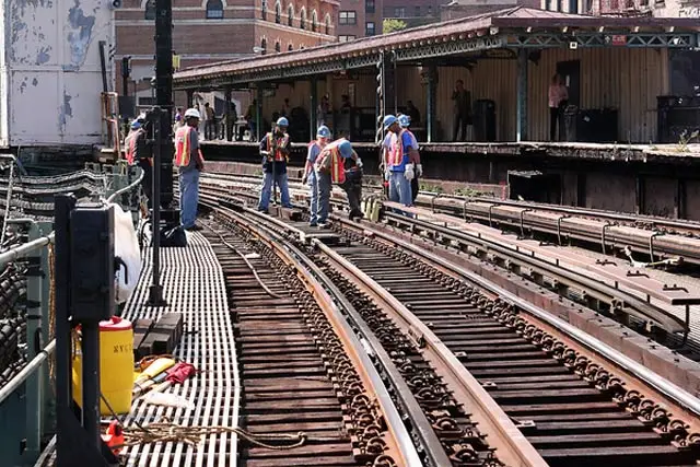"Track Workers prepare to remove and install new track rail fasteners at Dyckamn St (1)."